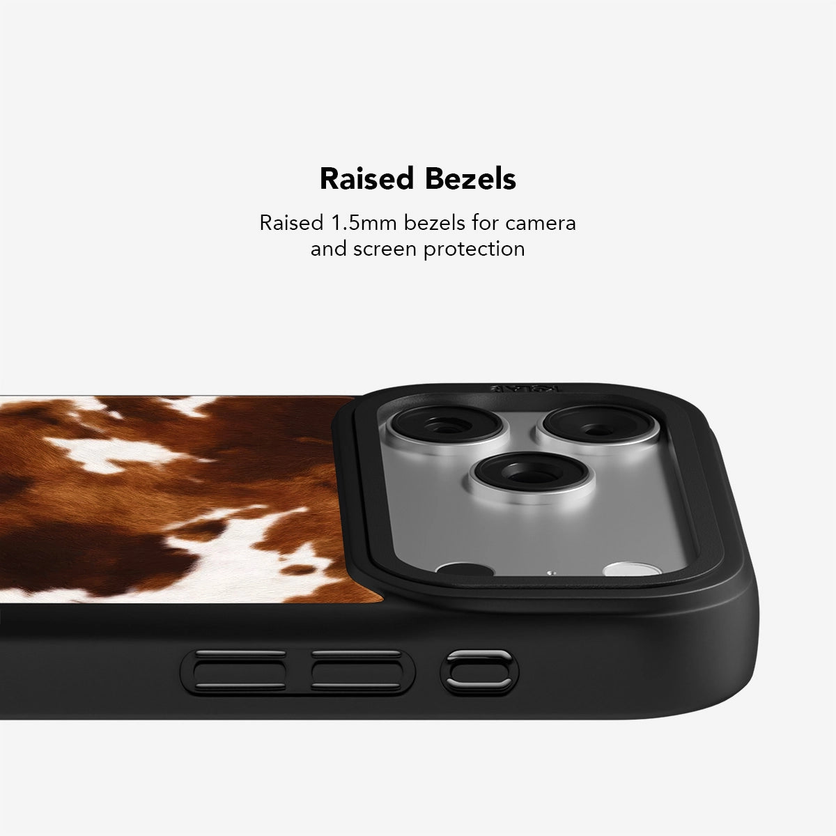 Close-up of KELAB cow print iPhone case showing 1.5mm raised bezels for enhanced screen and camera protection in a rugged design.