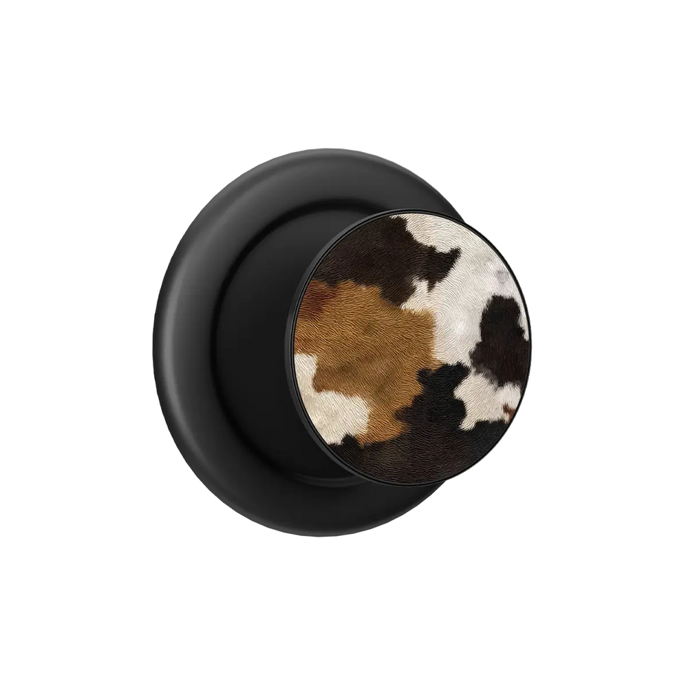 Cow print MagSafe phone grip pop grip with built-in strong magnets and black base.