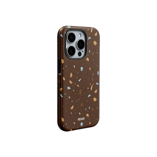 KELAB deep brown terrazzo phone case with abstract speckled pattern in earthy tones. Sleek design for modern iPhone protection.