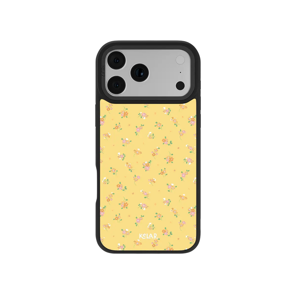 Yellow KELAB iphone case with floral pattern and black bumper around the camera lenses