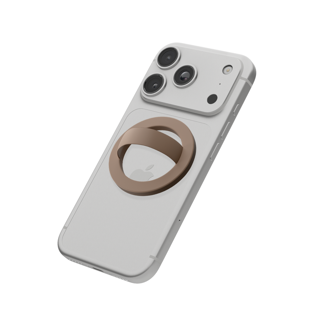 Brown MagSafe loop grip attached to the back of an iPhone