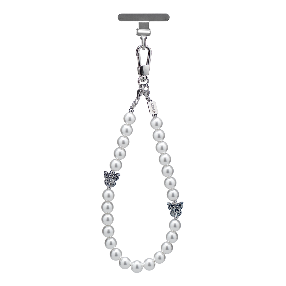 Elegant white pearl phone charm with silver clasp and ornate embellishments for a chic accessory.