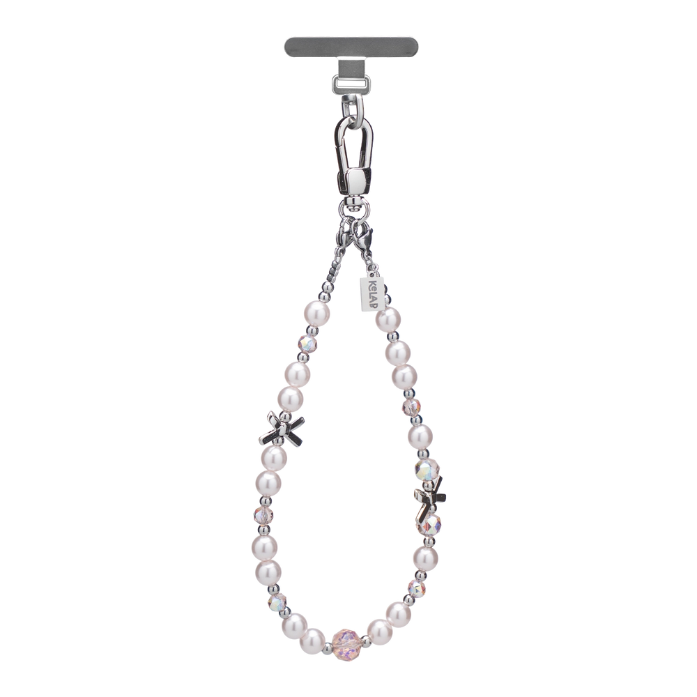 Elegant pearl phone charm with silver accents and crystal embellishments, perfect for special occasions.