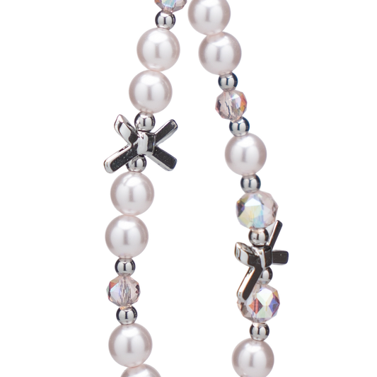 Elegant pearl beaded phone charm with crystal accents and silver cross charms, perfect for special occasions.
