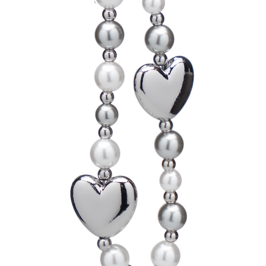 Silver heart phone charm with alternating pearlescent beads, stylish and elegant accessory for any occasion.
