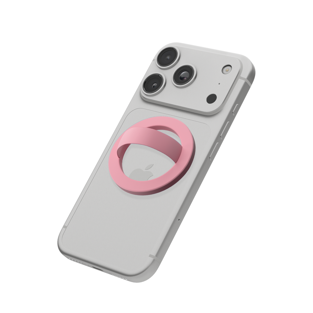 Light pink MagSafe loop grip attached to the back of an iPhone