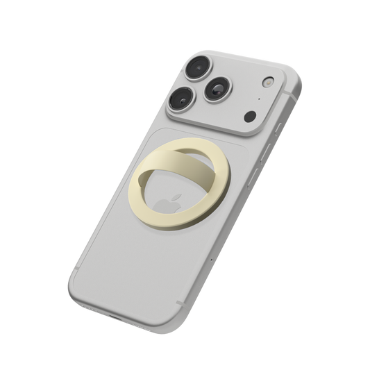Butter yellow MagSafe loop grip attached to the back of an iPhone