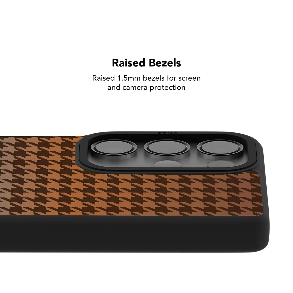 Raised bezel on the brown houndstooth Galaxy case lifting the camera lenses clear of a flat surface
