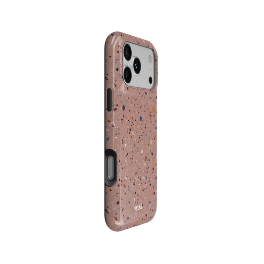Rose Clay pink paint splatter Tough iPhone case, side view showing the pattern wrapped around the shell.