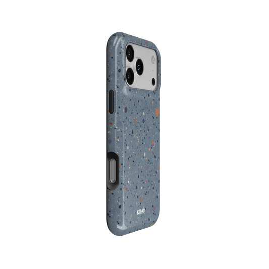 Seaside Drift blue paint splatter Tough iPhone case, side view showing the pattern wrapped around the shell.