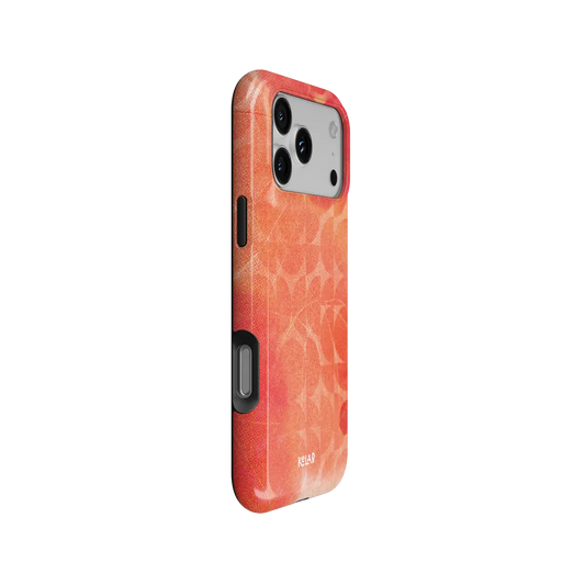 Sunset Squeeze red retro geometric circles Tough iPhone case, side view showing the pattern wrapped around the shell.