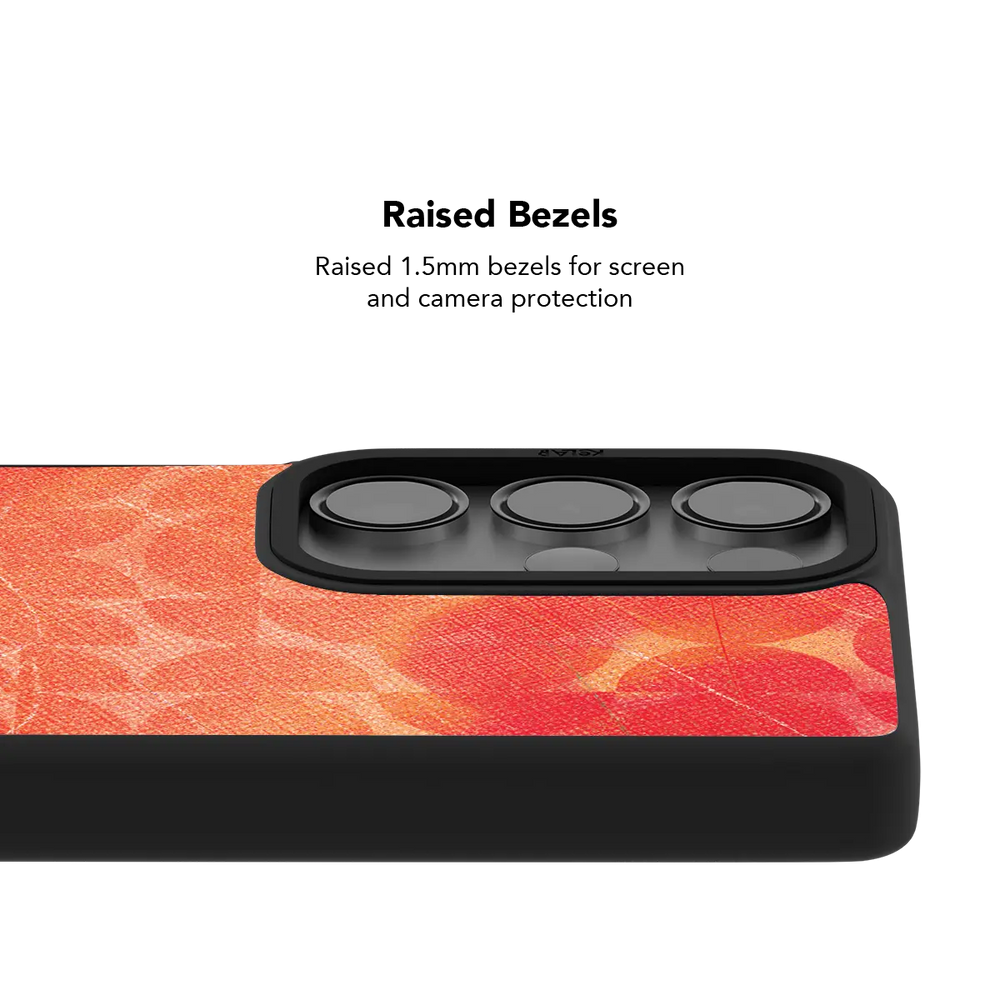 Raised bezel on the red retro geometric Galaxy case lifting the camera lenses clear of a flat surface