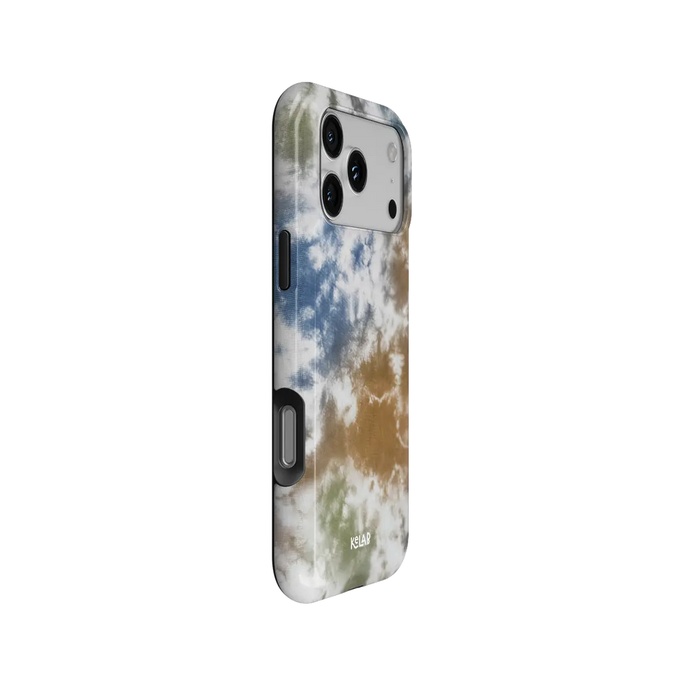 Indigo Soil brown-blue tie-dye Tough iPhone case, side view showing the pattern wrapped around the shell.