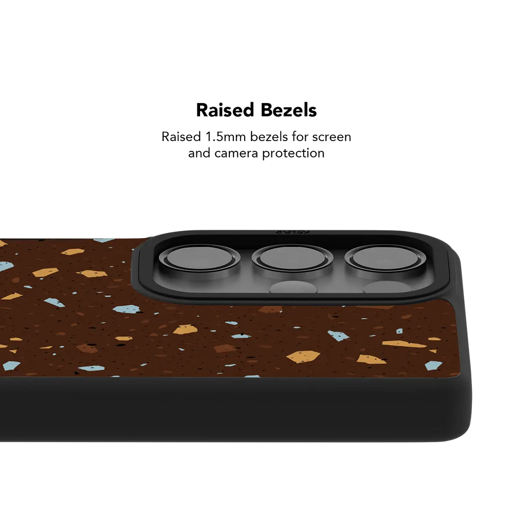 Raised bezel on the brown terrazzo Galaxy case lifting the camera lenses clear of a flat surface