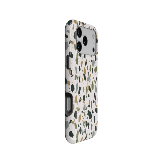Pistachio Cream white terrazzo Tough iPhone case, side view showing the pattern wrapped around the shell.