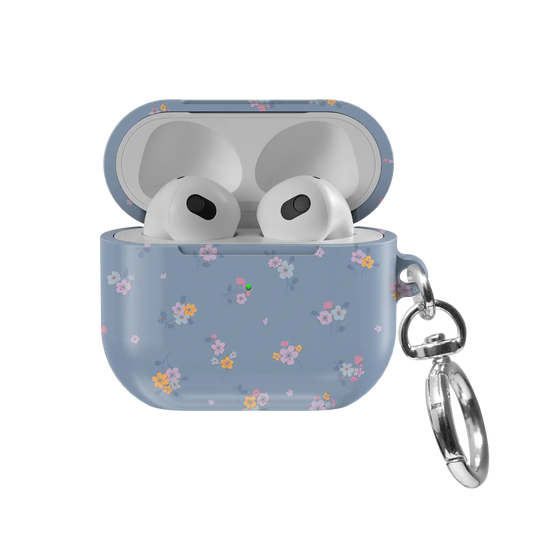 Tiny Meadow AirPods case — front view with lid open, showing pastel blue floral pattern and AirPods nested inside