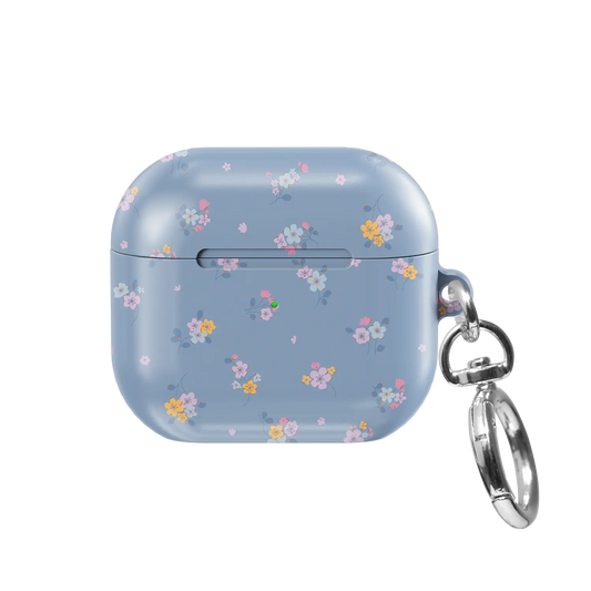 Tiny Meadow AirPods case — front view showing dainty pastel wildflower pattern with keychain clasp