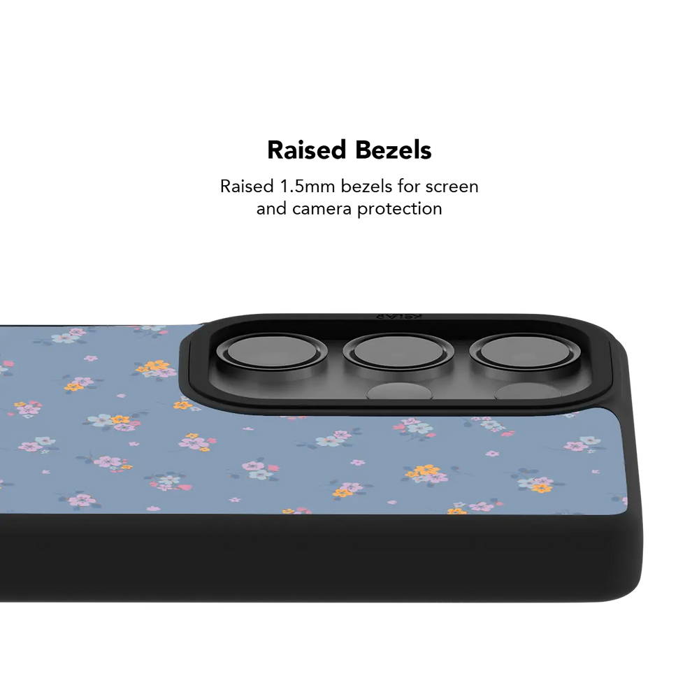 Raised bezel on the pastel blue floral Galaxy case lifting the camera lenses clear of a flat surface