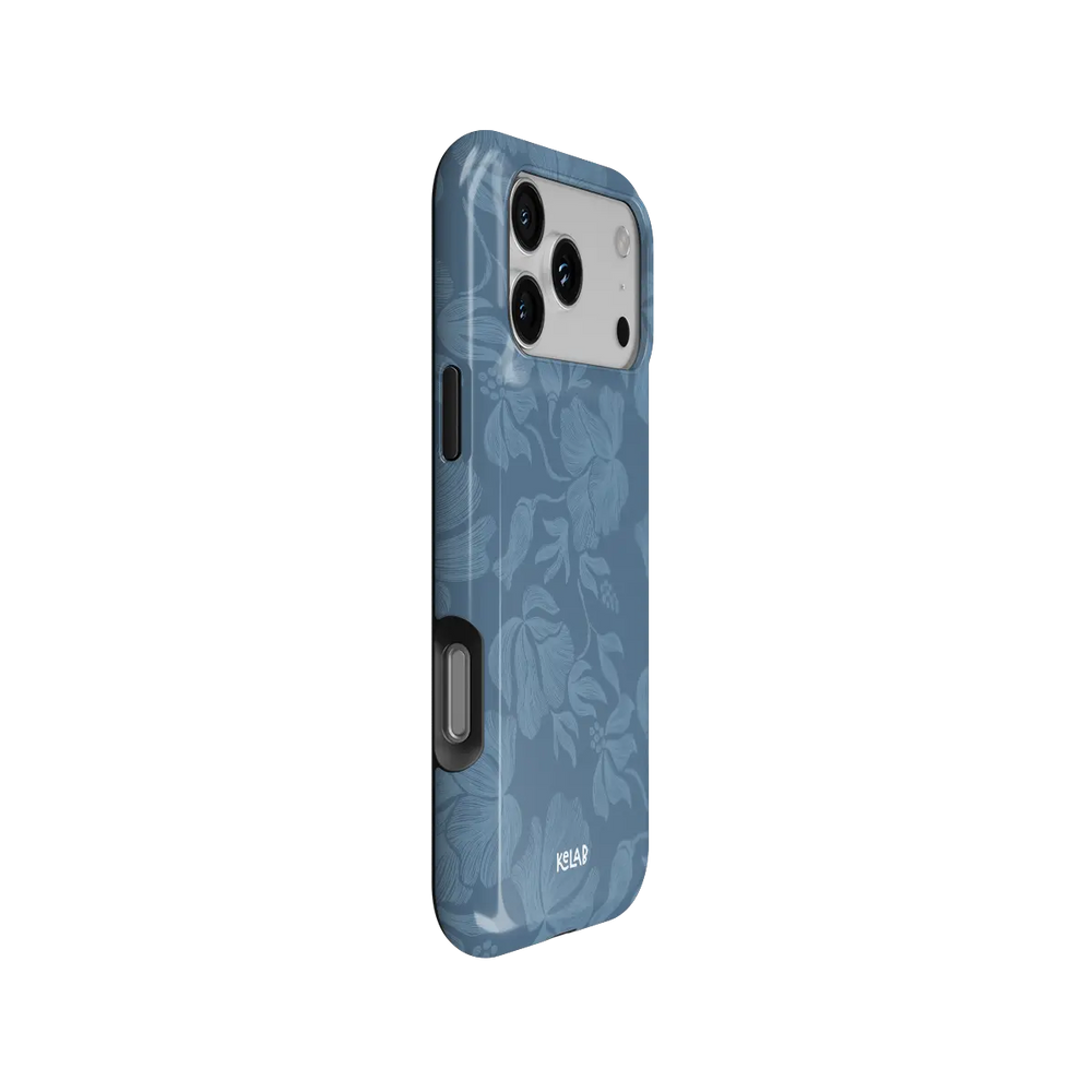 Dusty blue floral Tough iPhone case, side view with pattern wrapped around buttons.