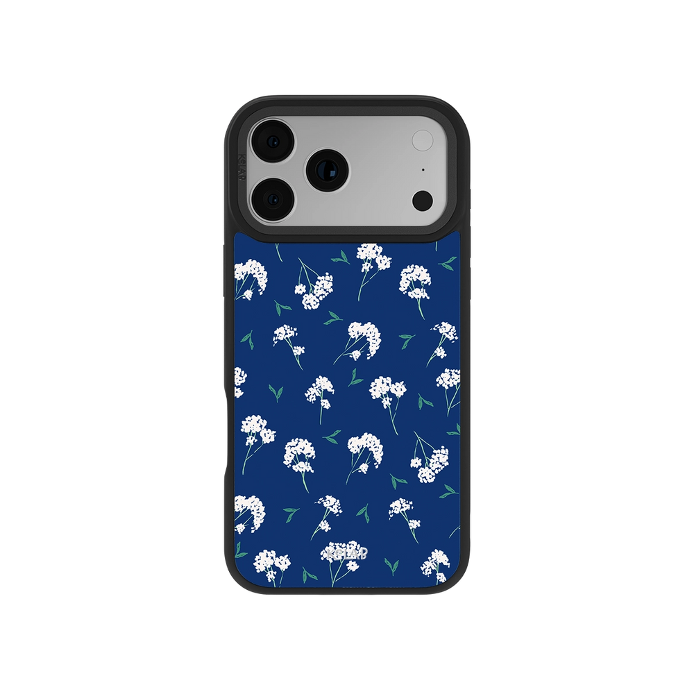 White floral iPhone case with cobalt blue background featuring baby's breath design and green leaves, perfect for a stylish botanical look.