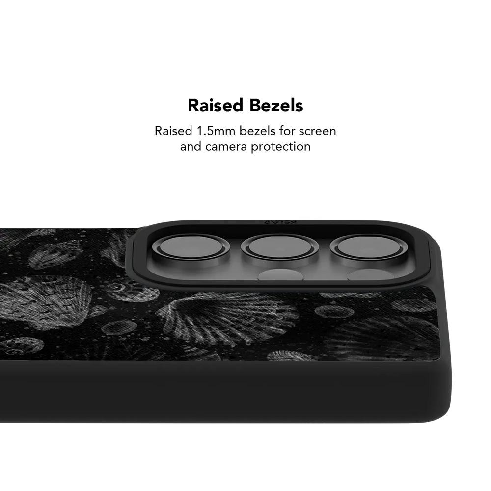 Raised bezel on the black seashell Galaxy case lifting the camera lenses clear of a flat surface