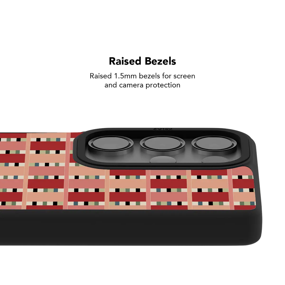 Raised bezel on the red pink checkered Galaxy case lifting the camera lenses clear of a flat surface