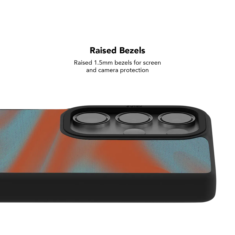Raised bezel on the orange Y2K Galaxy case lifting the camera lenses clear of a flat surface