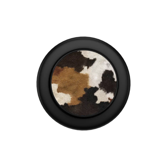 Black MagSafe phone grip with cow print design and built-in strong magnets pop grip.