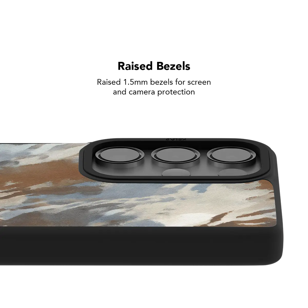 Raised bezel on the watercolor abstract Galaxy case lifting the camera lenses clear of a flat surface