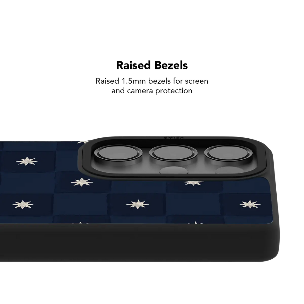 Raised bezel on the navy checkerboard Galaxy case lifting the camera lenses clear of a flat surface