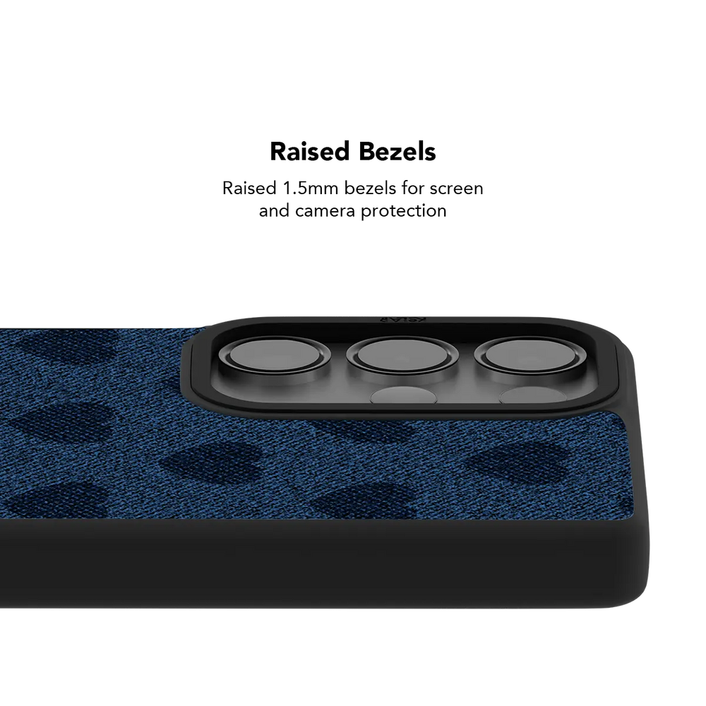 Raised bezel on the denim heart Galaxy case lifting the camera lenses clear of a flat surface