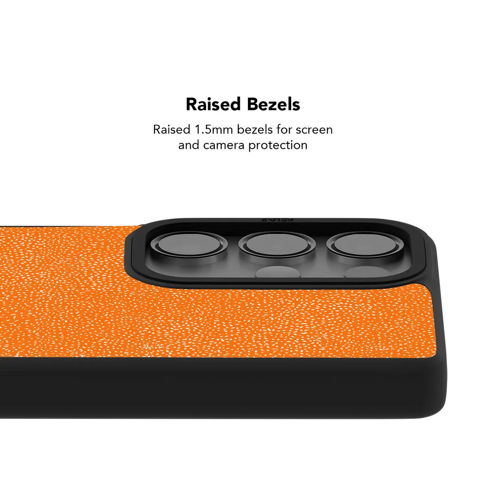 Raised bezel on the orange textured Galaxy case lifting the camera lenses clear of a flat surface