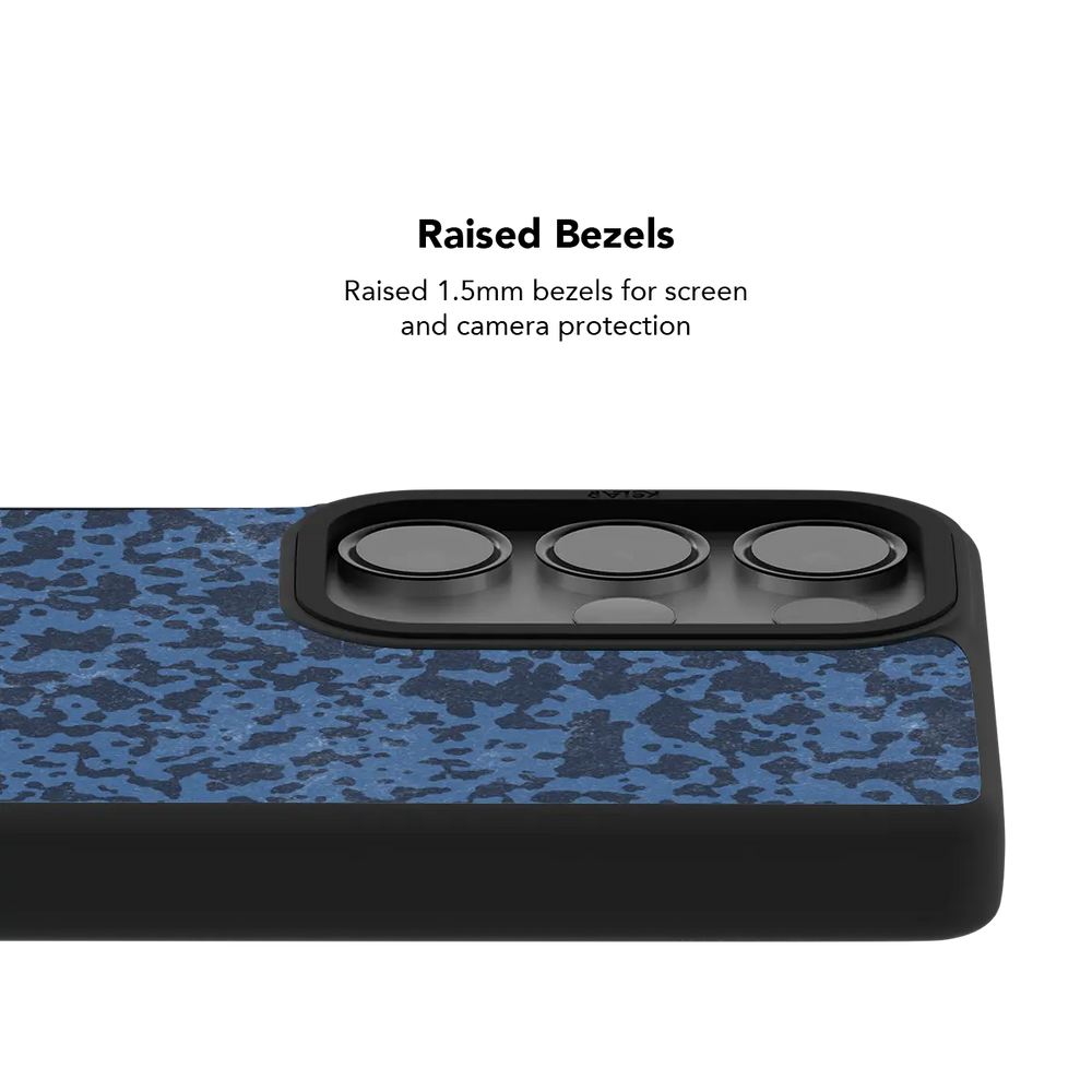 Raised bezel on the navy marble Galaxy case lifting the camera lenses clear of a flat surface