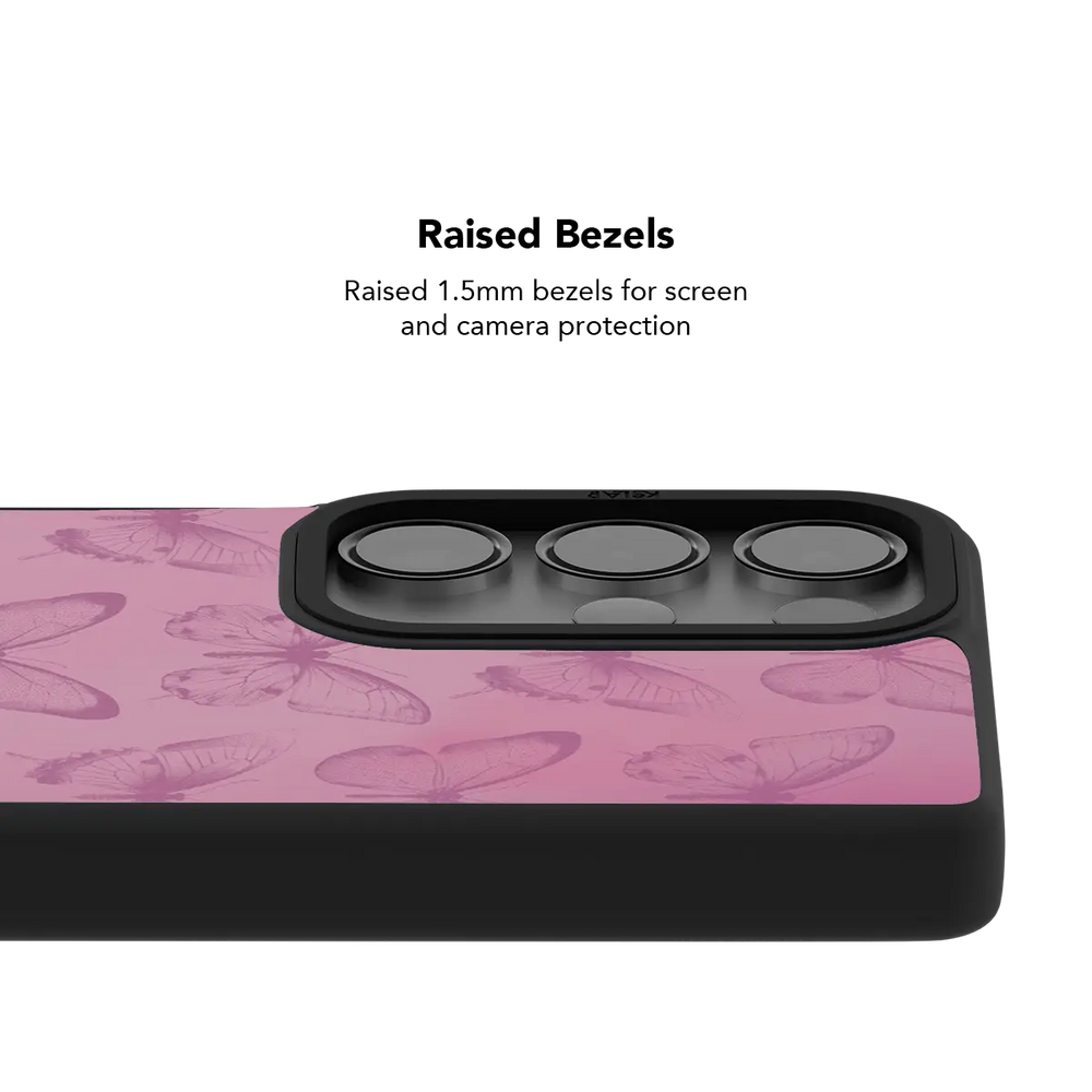 Raised bezel on the pink butterfly Galaxy case lifting the camera lenses clear of a flat surface