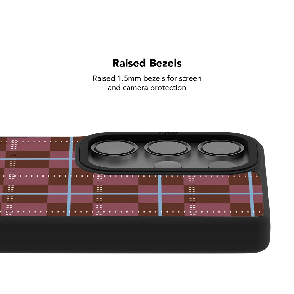 Raised bezel on the maroon plaid Galaxy case lifting the camera lenses clear of a flat surface
