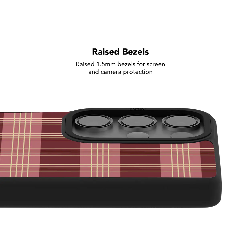 Raised bezel on the burgundy plaid Galaxy case lifting the camera lenses clear of a flat surface