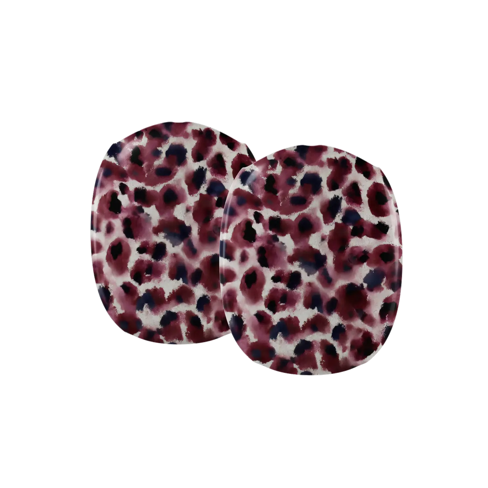 Close up detail of dark wine cheetah spots on an AirPods Max earcup cover.
