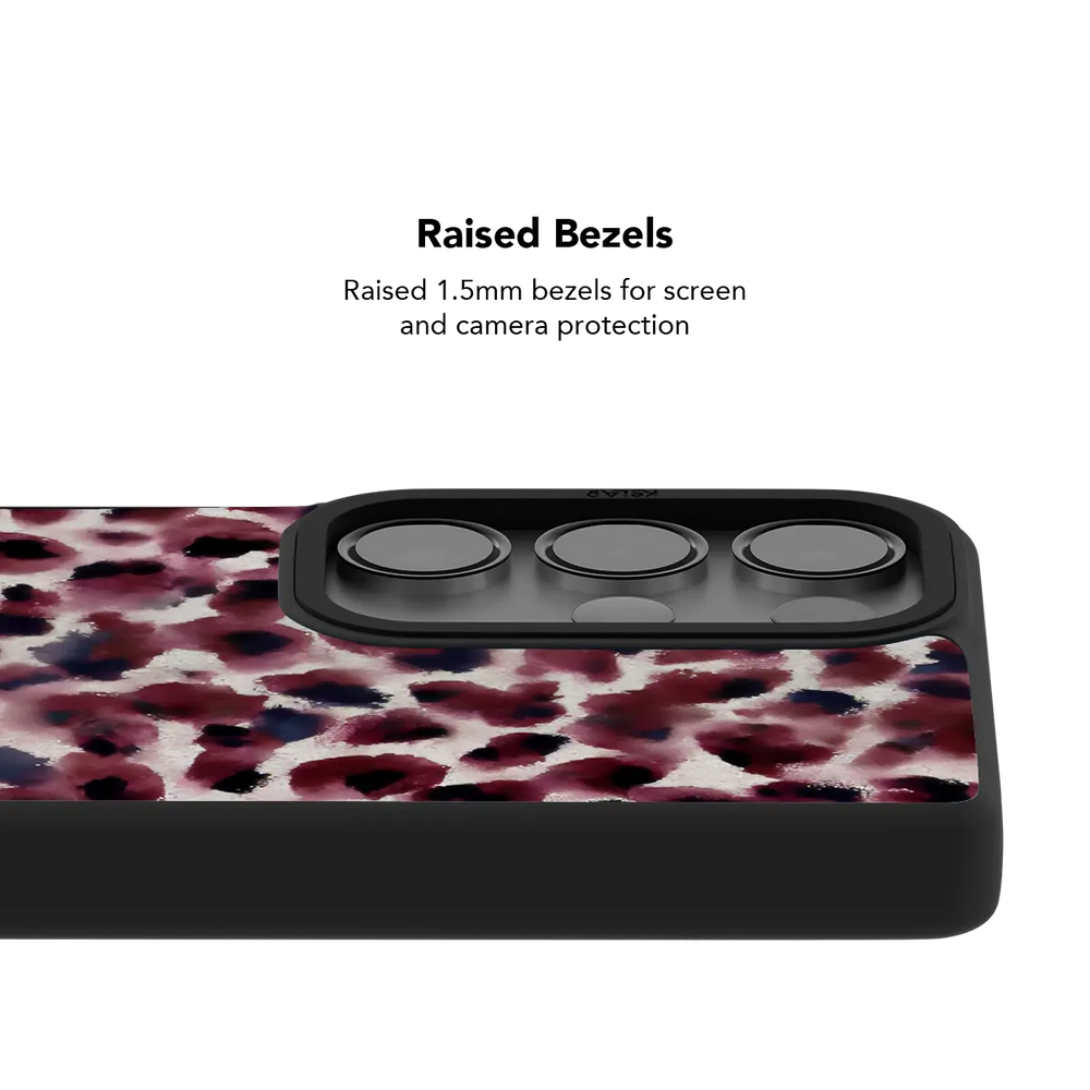 Raised bezel on the Bitten dark red cheetah Galaxy case lifting the camera lenses clear of a flat surface.