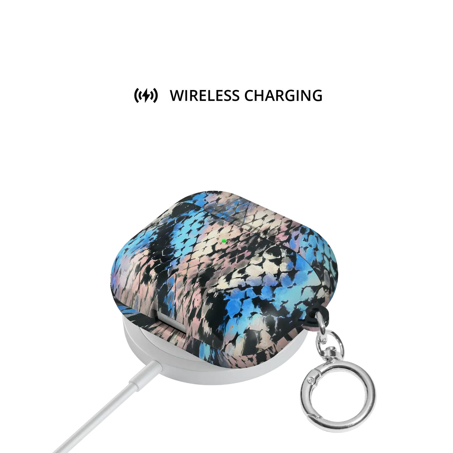 Glacier Coil | Blue Snake Print AirPods Case - shown on wireless charger