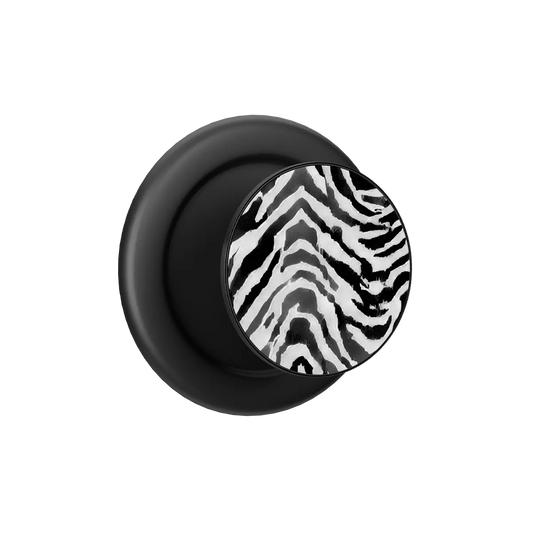 Zebra Crossing black and white zebra print MagSafe phone grip with black ring, expanded and standing open.