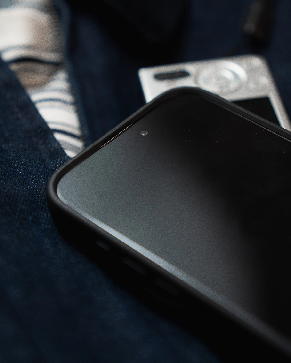 screen side view of a phone with a KELAB phone case featuring a raised edge that protects the phone screen