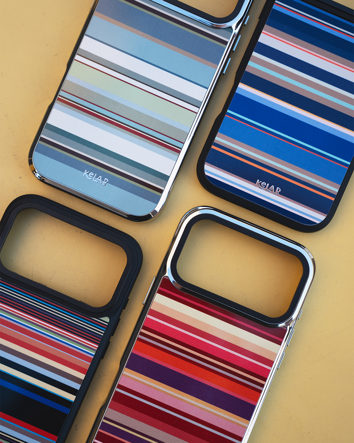Warm Red Multi-Stripe iPhone case shown alongside other KELAB multi-stripe colorways in blue-grey and navy