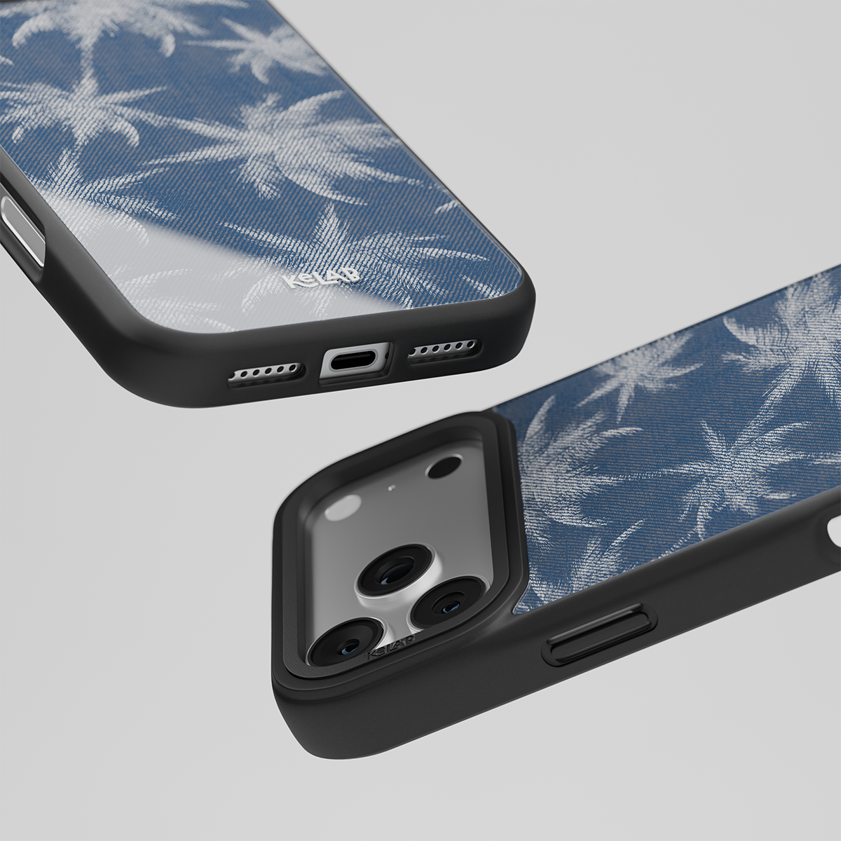 Close-up of the KELAB phone case, featuring precise cutouts for the charging port, speakers, and side buttons, along with a raised protective rim around the triple-lens camera.