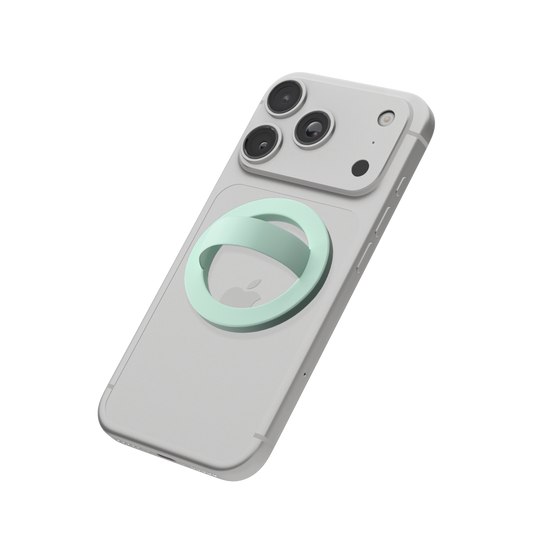 Mint green MagSafe loop grip attached to the back of an iPhone