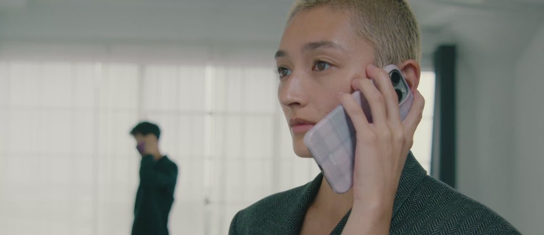 Brand Campaign video for desktop site features two model holding KELAB phone case with minimalist visual style