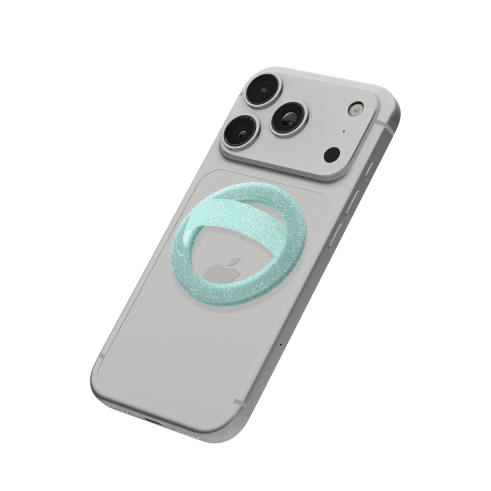 Mint glitter MagSafe loop grip attached to the back of an iPhone