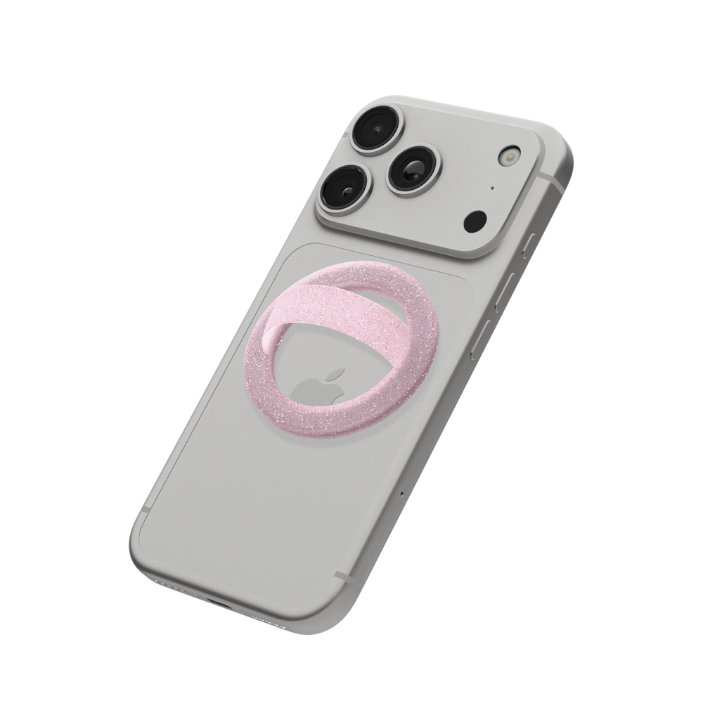 Pink glitter MagSafe loop grip attached to the back of an iPhone