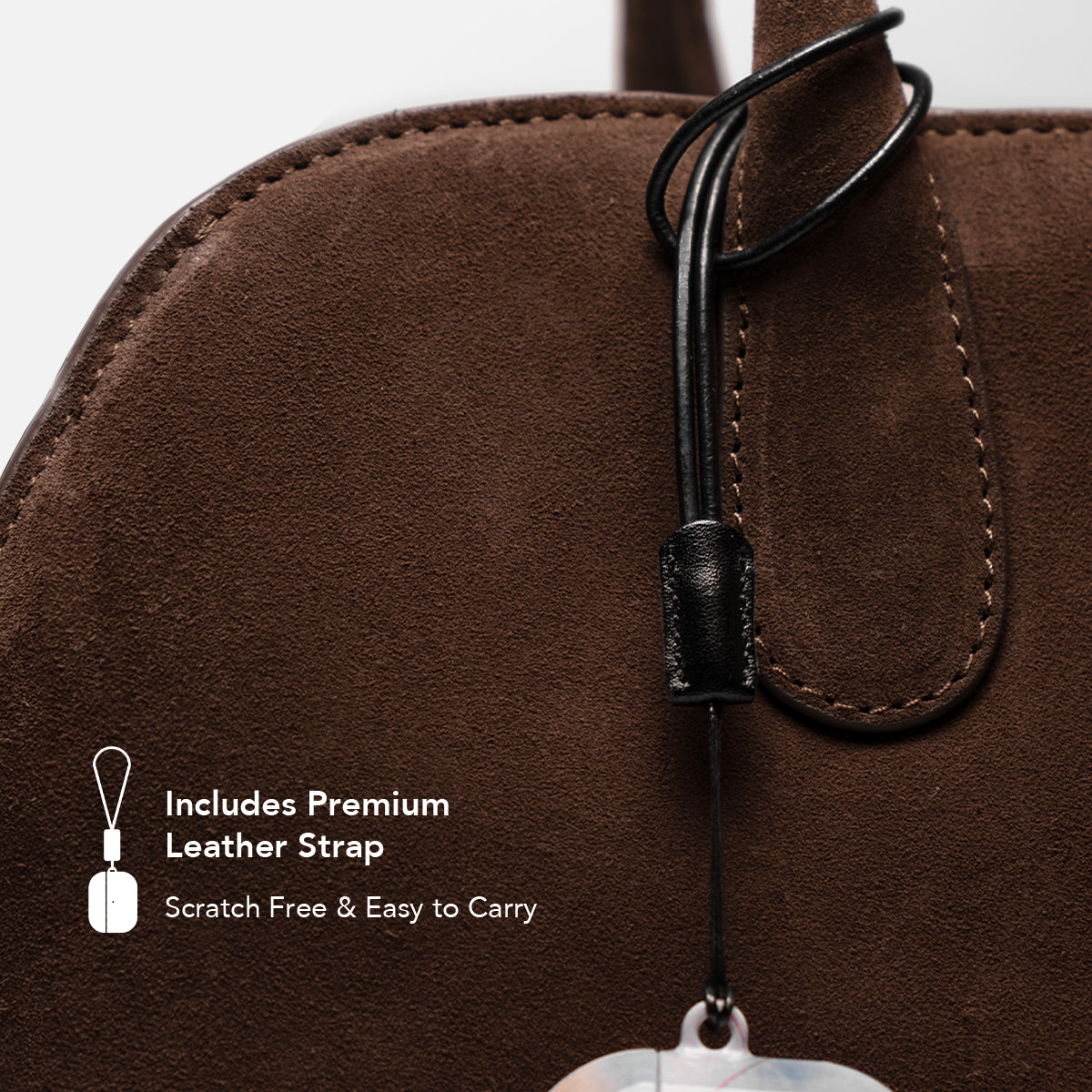 Close-up of premium leather strap included with the  AirPods Case, shown attached to a brown suede bag.