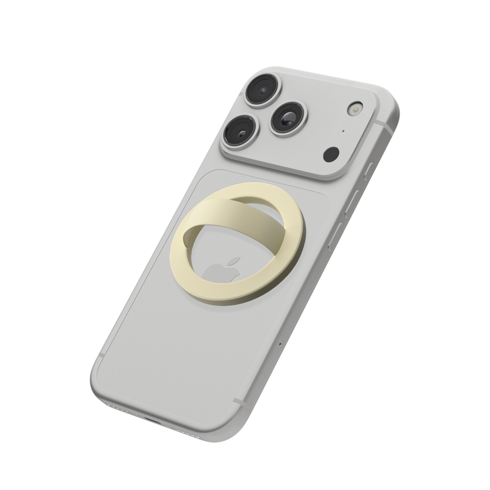 Butter yellow MagSafe loop grip attached to the back of an iPhone